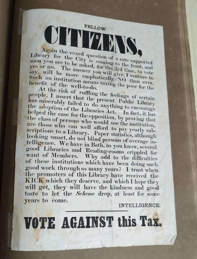 A3 black and white poster in scrapbook. Main words: Fellow Citizens Vote against this Tax
