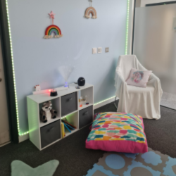 room with bean bag and other objects and low lights