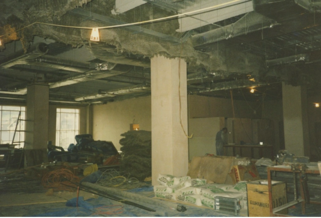 Inside of half finished building, insulation visible through ceiling