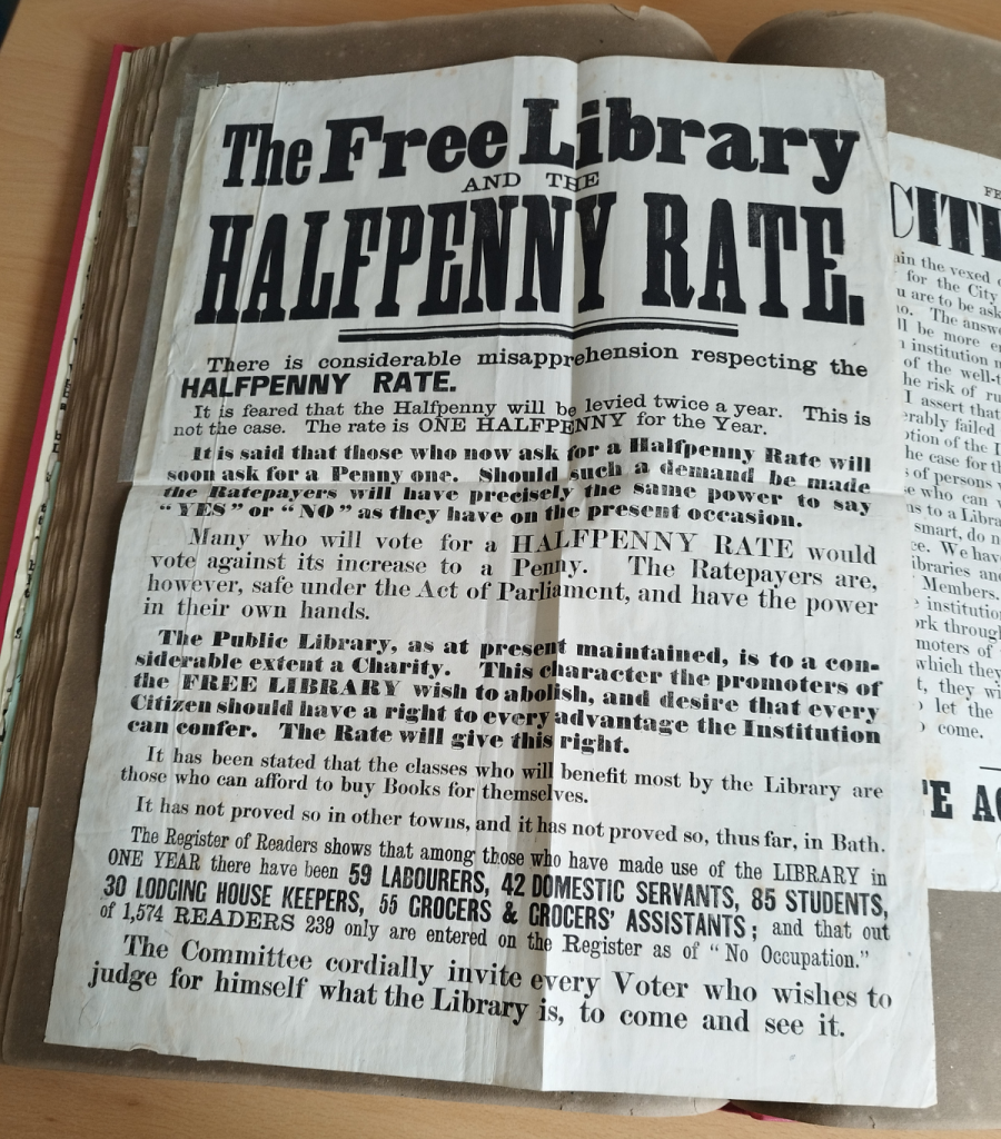 A3 black and white poster in scrapbook. titled The Free Library at the Halfpenny Rate