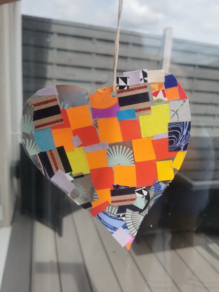 transparent heart filled with coloured squares hanging from twine