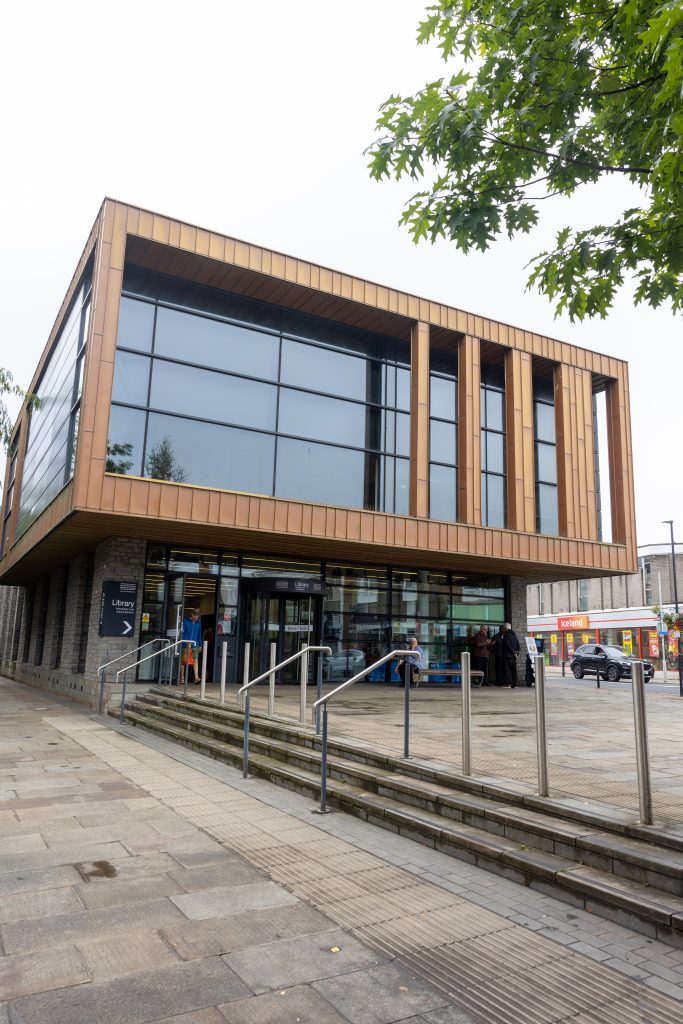 modern two storey building with cladding and large glass panes