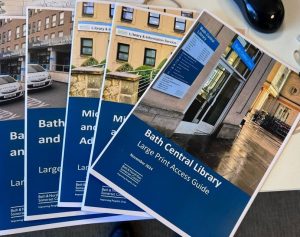 Printed guide of Bath Central Library on a desk with other guides
