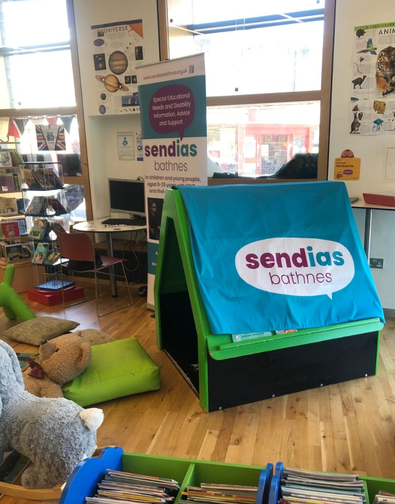 children's area in library with Sendias logo on material draped over shelving