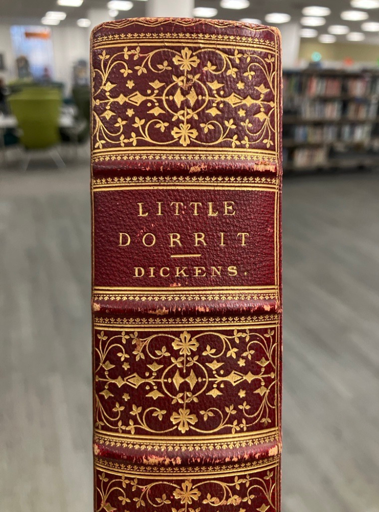 Spine of Little Dorrit. Red leather with gold decoration.