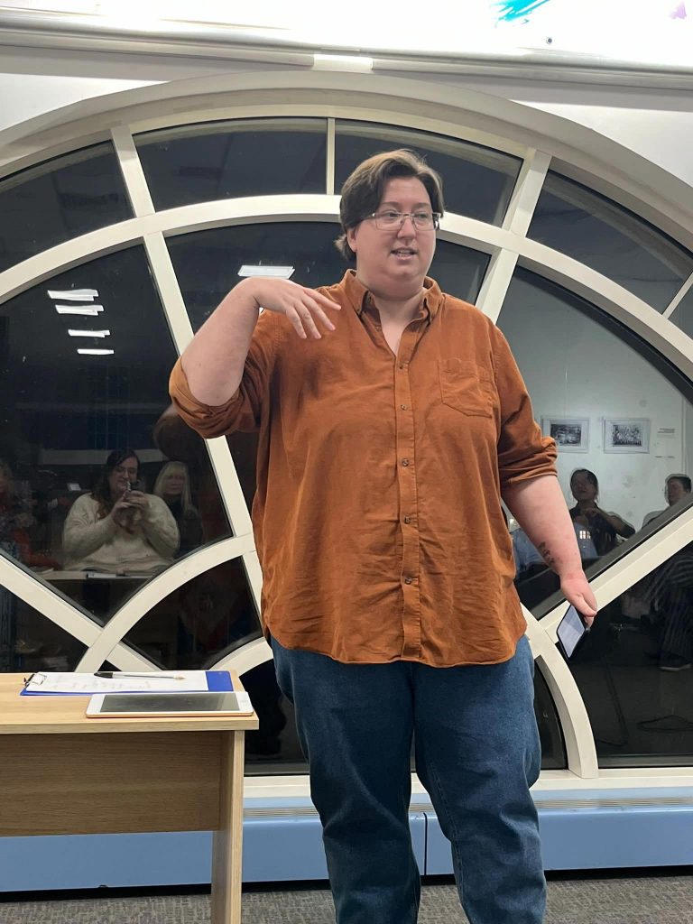 Woman stood talking to audience