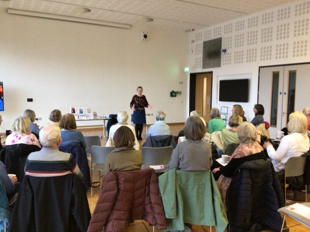 woman stood talking to an audience