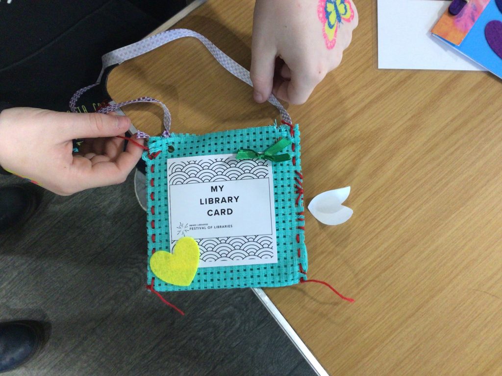 square wallet decorated with ribbons and hearts with 'My Library card' label