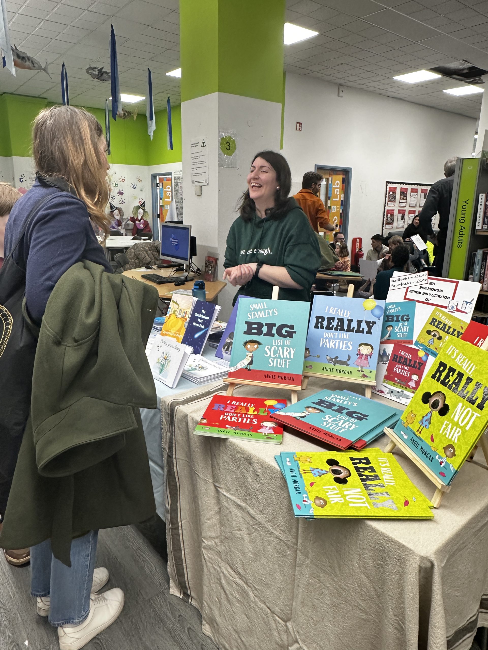 Author stood laughing with member of the public